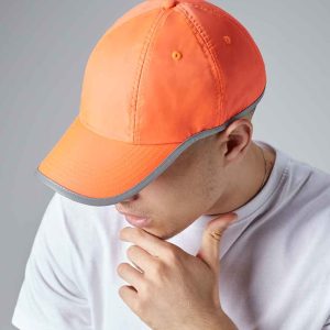 Side view of a man contemplating while wearing the BB35 Beechfield Enhanced-Viz Cap, a key piece for workwear for construction visibility.