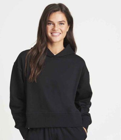 Woman smiling in the JH305 AWDis Ladies Relaxed Hoodie, ideal for a cosy, casual professional look.