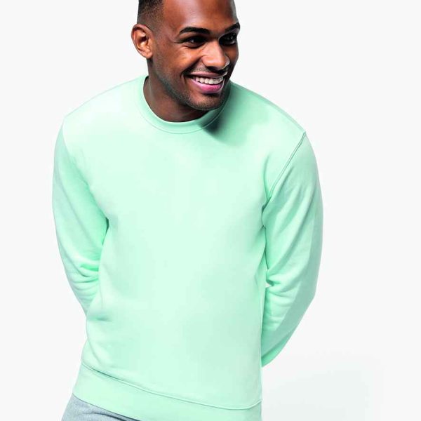 Man smiling in the KB4025 Kariban Unisex Eco-Friendly Crew Neck Sweatshirt, reflecting a commitment to sustainability.