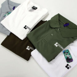 Branded workwear items laid out together as part of a uniform order