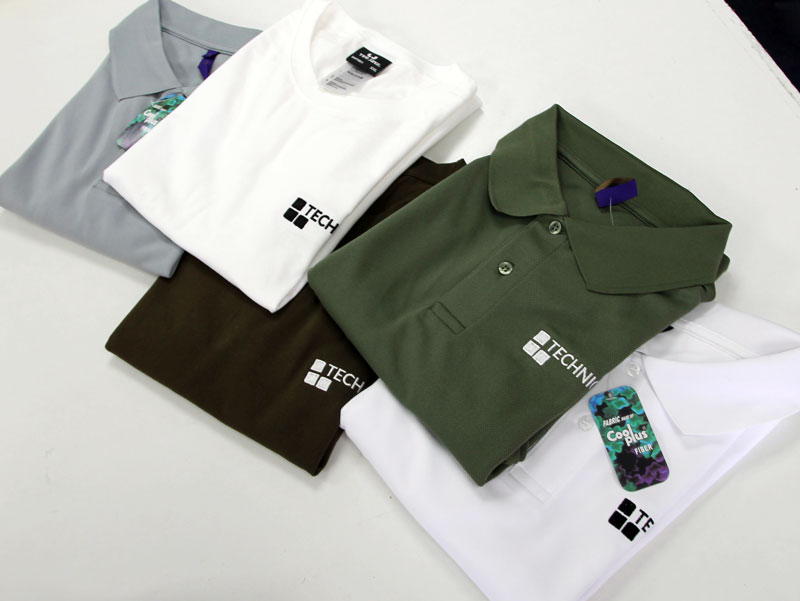 Branded workwear items laid out together as part of a uniform order