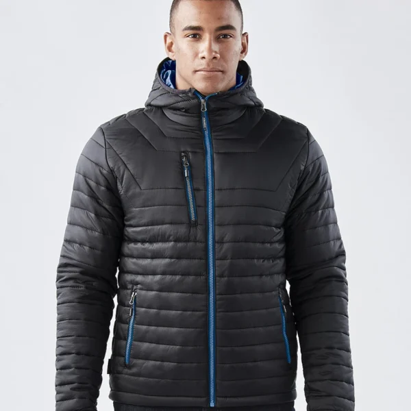 Stormtech Gravity Thermal Jacket in Black/Marine Blue, worn