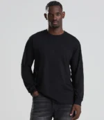 AWDis Long Sleeve 180 T-Shirt in Deep Black, worn