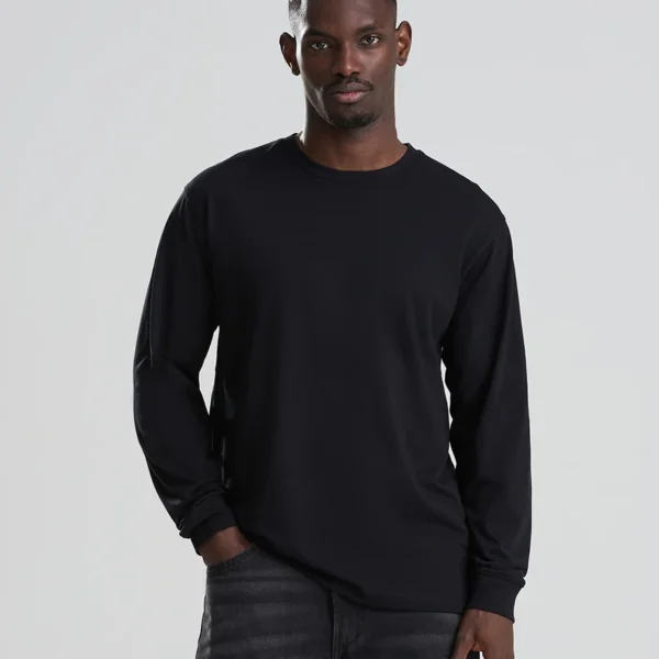 AWDis Long Sleeve 180 T-Shirt in Deep Black, worn