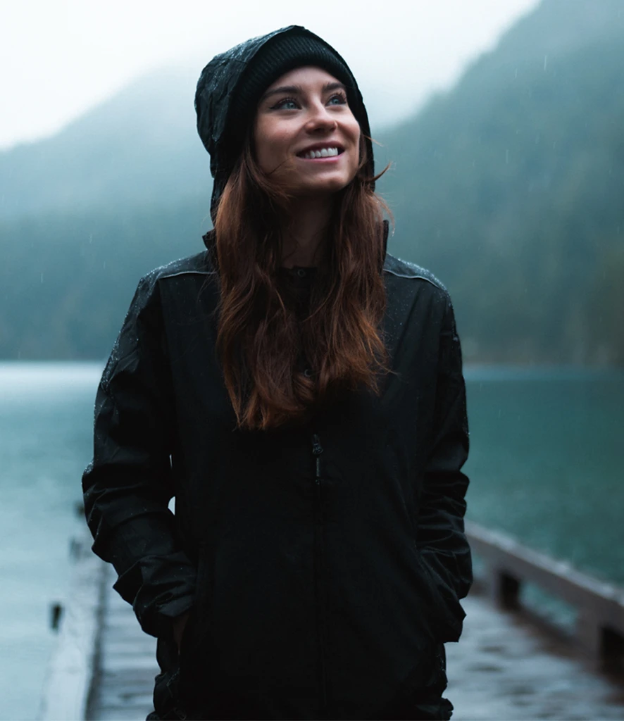 kx1w-blk-model Stormtech Ladies Nautilus Performance Shell Jacket in Black, worn