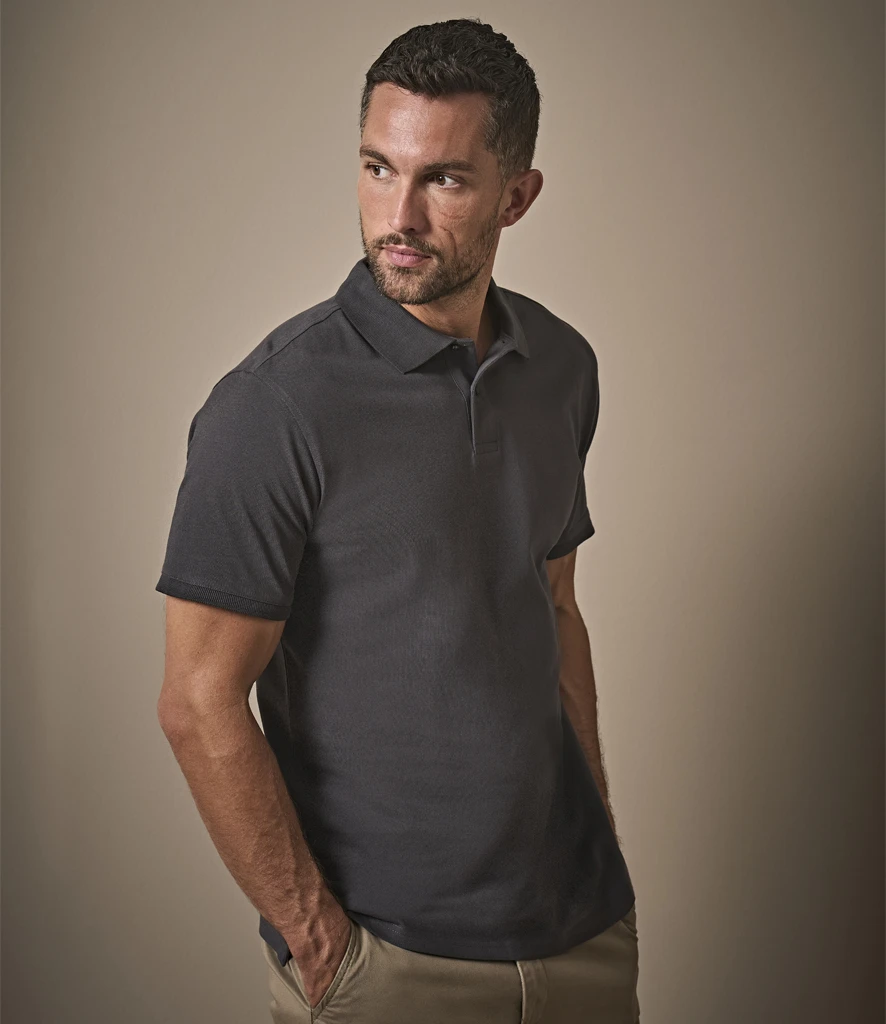 Tee Jays Heavy Cotton Pique Polo Shirt in Dark Grey, worn