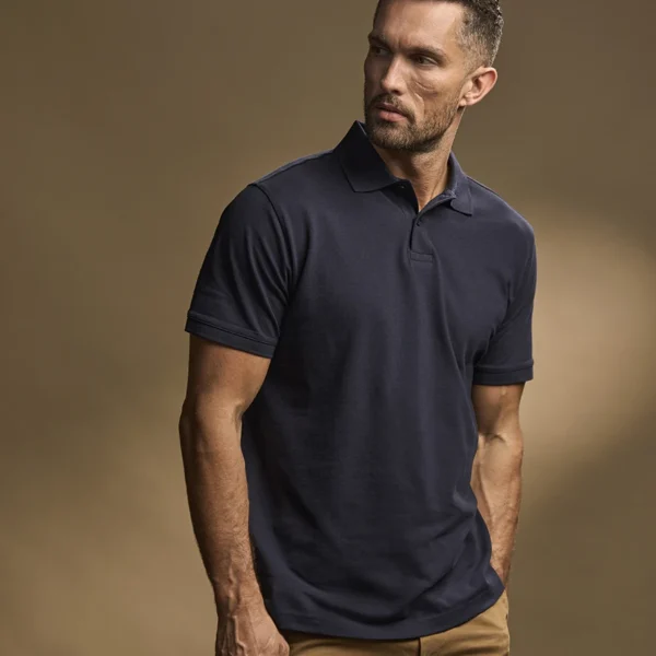 Tee Jays Heavy Cotton Pique Polo Shirt in Navy, worn