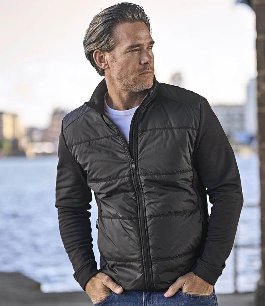 Tee Jays Hybrid-Stretch Jacket in Black/Black, worn