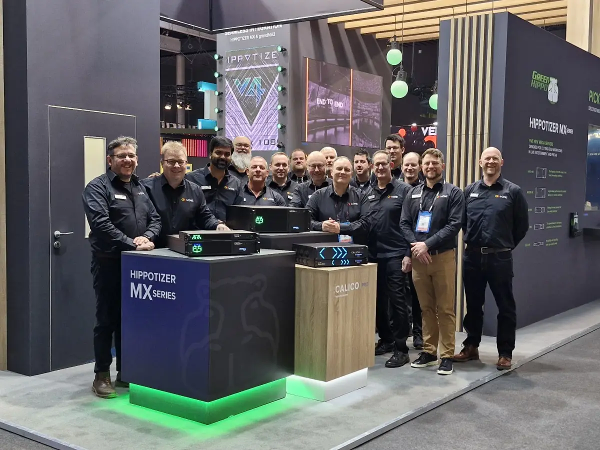 TVOne team in branded shirts on their stand at ISE