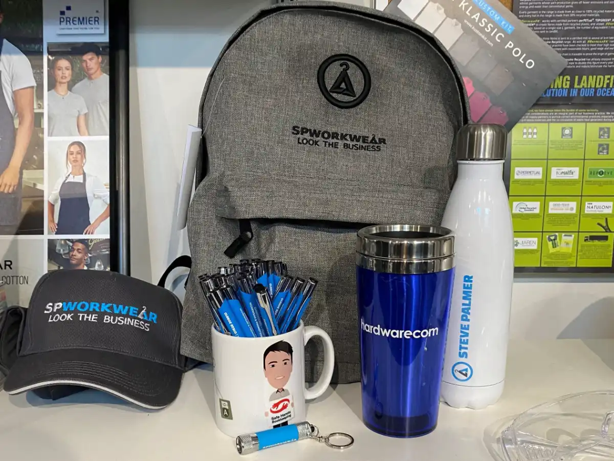 Branded merchandise in our Maidenhead showroom: backpack, cap, pens, mugs and bottles