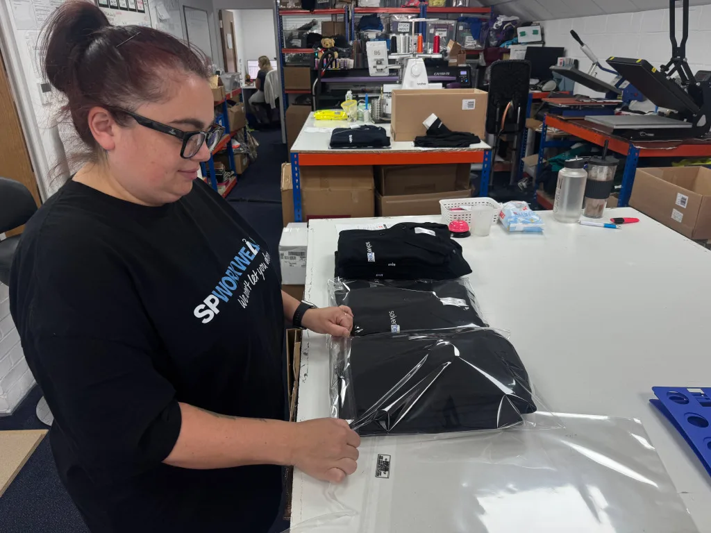 Chloe bagging up a team order ready for packing