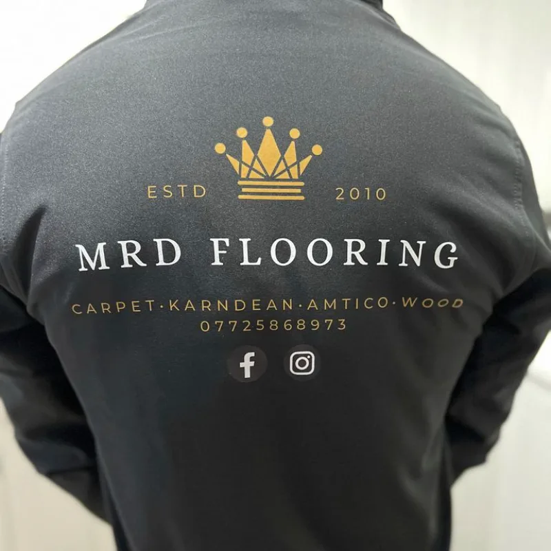 Back print of the MRD Flooring logo on a charcoal sweatshirt