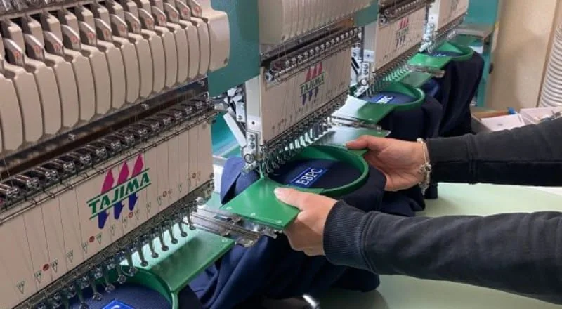 Loading garments onto our embroidery machines in Maidenhead